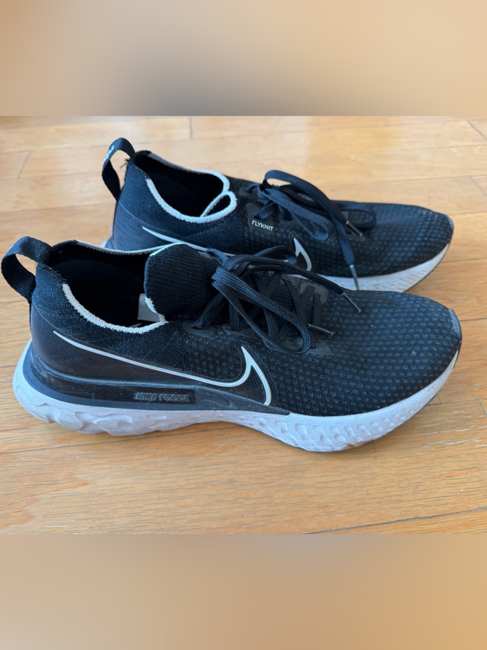 Nike Men's React Flyknit Black and White Running Shoes